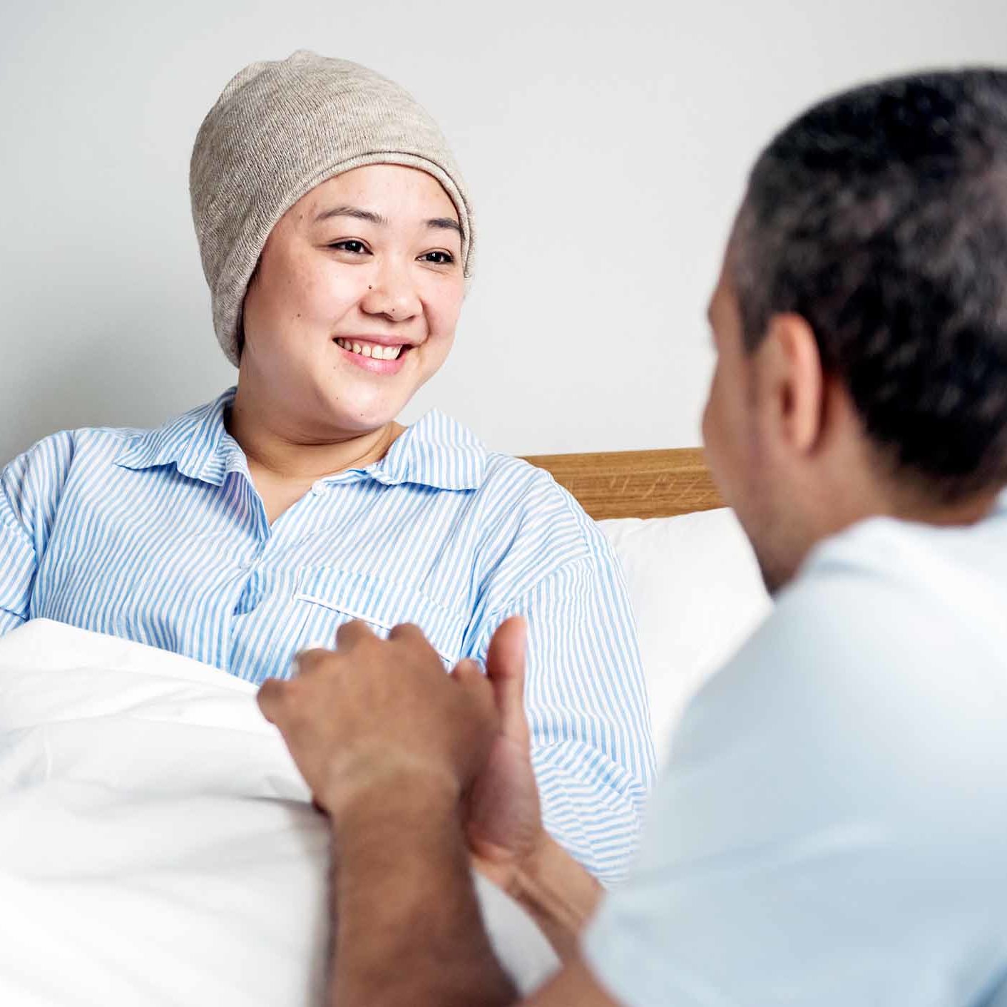 A sick woman in bed with her partner A sick woman in bed with her partner