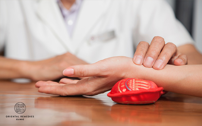 A man checking woman's pulse