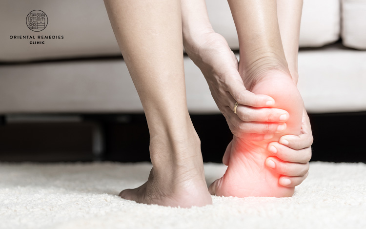 massaging left foot