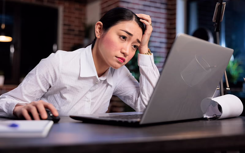 Stressed office employee experiencing burnout and physical strain